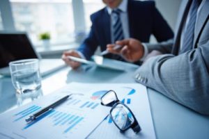 business people talking around a table